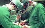 Illustrative: Doctors at Hadassah Hospital Ein Kerem performing surgery, Jerusalem, March 5, 1990. (Nati Shohat/Flash90/File)