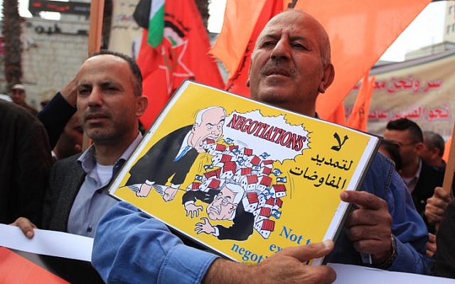 Palestinian supporters of Democratic Front for the Liberation of Palestine (DFLP) chant slogans during a demonstration against Israeli-Palestinian negotiations, in the West Bank city of Ramallah March 19, 2014. Photo By Issam Rimawi/Flash 90. Palestinian supporters of Democratic Front for the Liberation of Palestine (DFLP) chant slogans during a demonstration against Israeli-Palestinian negotiations, in the West Bank city of Ramallah March 19, 2014. Photo By Issam Rimawi/Flash 90.