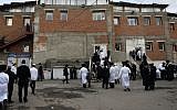 Illustrative photo of ultra-Orthodox Jewish men dressed in white robes on their way to the synagogue in Uman, Ukraine, on the eve of the Jewish New Year (Rosh Hashanah) in 2013. (Yaakov Naumi/Flash90)