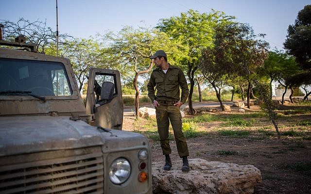 An Israeli soldier seen next to a patrol jeep near the northern Gaza Strip on April 7, 2016. (Corinna Kern/Flash90) An Israeli soldier seen next to a patrol jeep near the northern Gaza Strip on April 7, 2016. (Corinna Kern/Flash90)