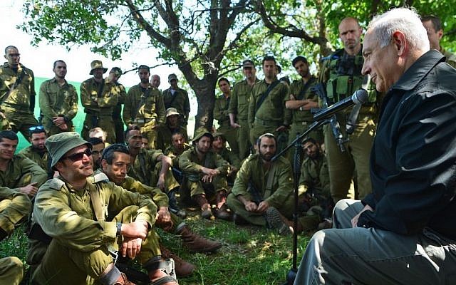 Prime Minister Benjamin Netanyahu meets with Israeli soldiers in the Golan Heights during a tour of the area on April 11, 2016. (Kobi Gideon/GPO) Prime Minister Benjamin Netanyahu meets with Israeli soldiers in the Golan Heights during a tour of the area on April 11, 2016. (Kobi Gideon/GPO)