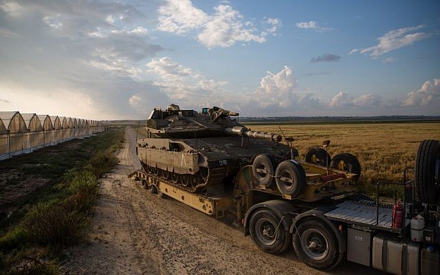 A tank is transported near Kibbutz Be'eri just outside the central Gaza Strip on April 13, 2016. (Corinna Kern/Flash90) A tank is transported near Kibbutz Be'eri just outside the central Gaza Strip on April 13, 2016. (Corinna Kern/Flash90)