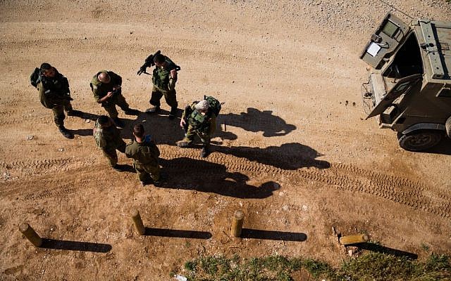 Israeli soldiers patrol just outside the central Gaza Strip on April 13, 2016 (Corinna Kern/Flash90) Israeli soldiers patrol just outside the central Gaza Strip on April 13, 2016 (Corinna Kern/Flash90)