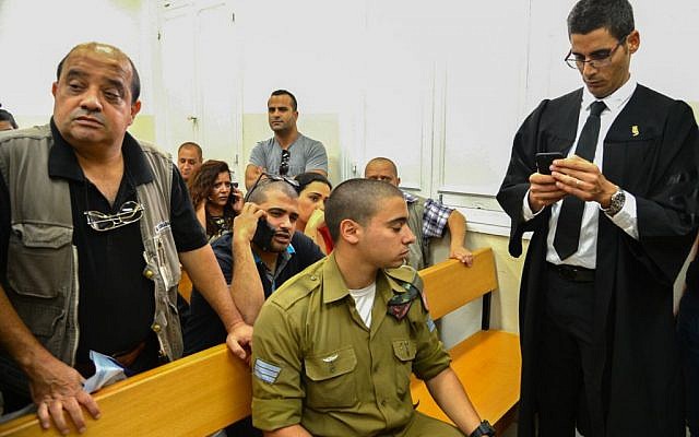 Sgt. Elor Azaria, accused of killing a disarmed Palestinian attacker in Hebron last month, arrives for a court hearing at Jaffa Military Court on April 18, 2016. (Flash90) Sgt. Elor Azaria, accused of killing a disarmed Palestinian attacker in Hebron last month, arrives for a court hearing at Jaffa Military Court on April 18, 2016. (Flash90)