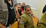 Sgt. Elor Azaria, the Israeli soldier who shot dead a disarmed Palestinian terrorist in Hebron last month, arrives for a court hearing at Jaffa Military Court on April 18, 2016. (Flash90)