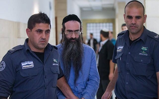 Yishai Schlissel, center, is led out of the courtroom at the Jerusalem District Court, April 19, 2016. (Yonatan Sindel/Flash90) Yishai Schlissel, center, is led out of the courtroom at the Jerusalem District Court, April 19, 2016. (Yonatan Sindel/Flash90)