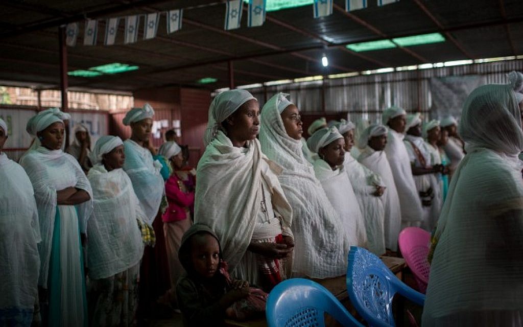 Members of the Falash Mura Jewish Ethiopian community wait for prayer service before attending the Passover seder meal, in the synagogue in Gondar, Ethiopia, April 22, 2016 (Miriam Alster/FLASH90)