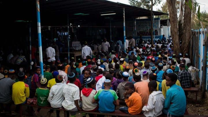 Young boys of the Falash Mura Jewish Ethiopian community wait for prayer service in the synagogue in Gondar, Ethiopia, April 22, 2016 (Miriam Alster/FLASH90)
