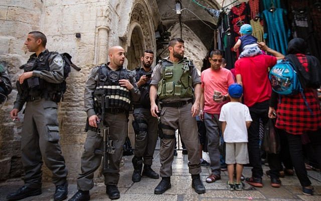 Israeli police officers guard at an entrance to the Al Aqsa Mosque on the Temple Mount in Jerusalem's Old City, during the Jewish holiday of Passover, on April 24, 2016. (Corinna Kern/Flash90 )