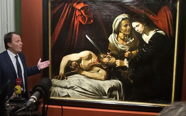 Auction officer Marc Labarbe presents 'Judith Beheading Holofernes' by Italian master Carvaggio in Paris, Tuesday, April 12, 2016. (AP/Michel Euler) Auction officer Marc Labarbe presents 'Judith Beheading Holofernes' by Italian master Carvaggio in Paris, Tuesday, April 12, 2016. (AP/Michel Euler)