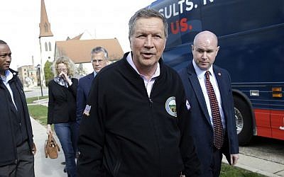 Republican presidential candidate, Ohio Gov. John Kasich hands a pen back to a supporter after signing his autograph during a campaign stop at Hofstra University, Monday, April 4, 2016, in Hempstead, N.Y. (AP/Julie Jacobson)