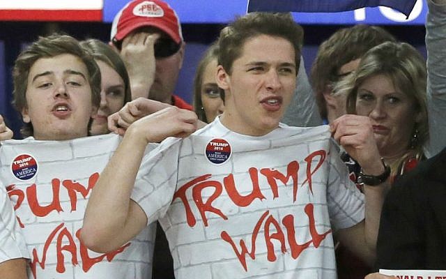 Supporters of Republican presidential candidate Donald Trump chant 'Build That Wall' before a town hall Saturday, April 2, 2016, in Rothschild, Wisconsin. (AP Photo/Charles Rex Arbogast) Supporters of Republican presidential candidate Donald Trump chant 'Build That Wall' before a town hall Saturday, April 2, 2016, in Rothschild, Wisconsin. (AP Photo/Charles Rex Arbogast)