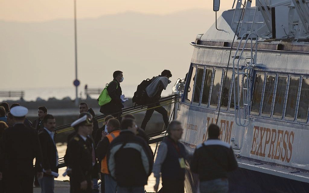 Migrants get on a ferry for Turkey at the port of Mytilini in the Greek island of Lesbos, Monday, April 4, 2016, during the first day of the implementation of a deal between EU and Turkey.(AP/Petros Giannakouris)