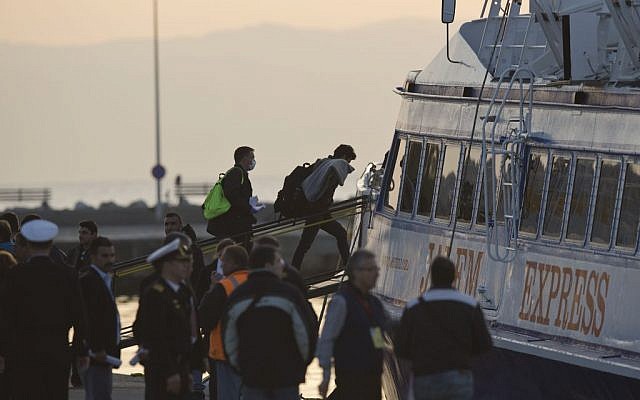 Migrants get on a ferry for Turkey at the port of Mytilini in the Greek island of Lesbos, Monday, April 4, 2016, during the first day of the implementation of a deal between EU and Turkey.(AP/Petros Giannakouris)