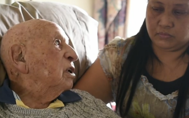 Holocaust survivor Richard Roberts being interviewed recently with his caregiver, Elenita Fernandez, in Sydney, Australian. (Screenshot via JTA) Holocaust survivor Richard Roberts being interviewed recently with his caregiver, Elenita Fernandez, in Sydney, Australian. (Screenshot via JTA)