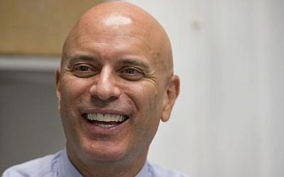 In this photo taken April 6, 2016, Tim Canova smiles as he speaks during an interview at his campaign headquarters in Hollywood, Florida. (AP Photo/Wilfredo Lee)
