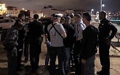 Israeli security and medics at the scene of a stabbing attack where one person was murdered and nine others were wounded in Jaffa Port, Tel Aviv on March 8, 2016. (Tomer Neuberg/Flash90)