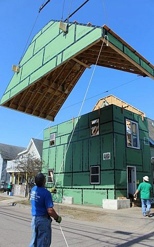 The artificial roof is hoisted by crane as engineers move the mural, 2015 (Courtesy)