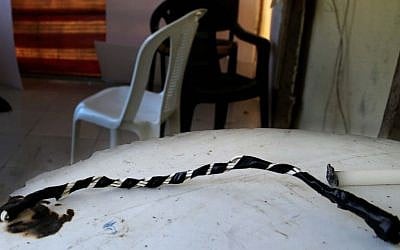 In this Thursday April 7, 2016 photo, a whip remains on the table of the guard's room of the Chez Maurice Hotel in Beirut, where Lebanese security forces have busted a sex trafficking ring involving 75 Syrian refugee women forced into prostitution. (AP Photo/Hussein Malla)