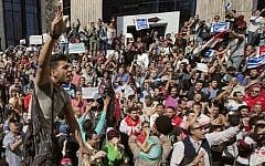 Egyptians shout slogans against Egyptian President Abdel-Fattah el-Sissi during a protest against the decision to hand over control of two strategic Red Sea islands to Saudi Arabia in front of the Press Syndicate, in Cairo, Egypt, Friday, April 15, 2016. Arabic reads, "Awad sold his land" and "Red Sea islands Sanafir and Tiran are Egyptian." (AP Photo/Amr Nabil)