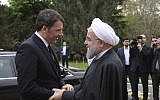Iran's President Hassan Rouhani welcomes Italian Prime Minister Matteo Renzi during an official arrival ceremony at the Saadabad Palace in Tehran, Iran, April 12, 2016. (Iranian Presidency Office via AP)