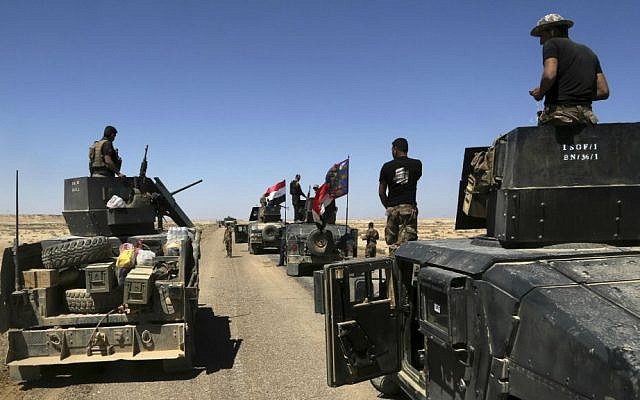 Iraqi security forces prepare to attack Islamic State group positions in Hit, 85 miles (140 kilometers) west of Baghdad, Iraq, Saturday, April 2, 2016. (AP Photo/Khalid Mohammed) Iraqi security forces prepare to attack Islamic State group positions in Hit, 85 miles (140 kilometers) west of Baghdad, Iraq, Saturday, April 2, 2016. (AP Photo/Khalid Mohammed)