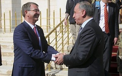 US Defense Secretary Ash Carter is greeted by Lt. Gen. Sean MacFarland, the top US Commander for the fight against the Islamic State group in Iraq and Syria, in Baghdad on April 18, 2016. (AP Photo/Lolita C. Baldor)