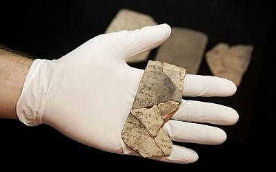 Letters inscribed on pottery, known as ostraca, which were unearthed in an excavation of a fort in Arad, Israel, and dated to about 600 BCE shortly before Nebuchadnezzar’s destruction of Jerusalem, are seen in Israel Museum in Jerusalem on April 12, 2016. (AP Photo/Dan Balilty)