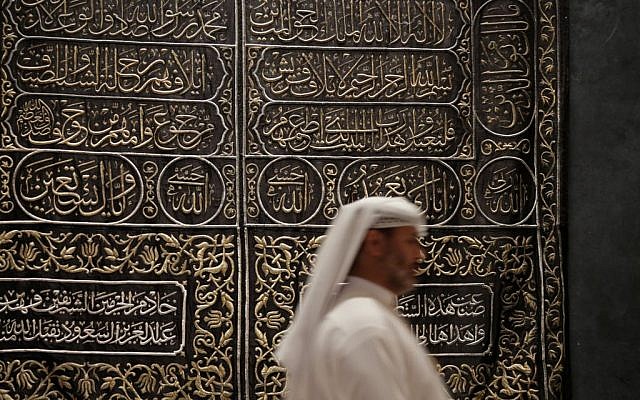 In this photo taken on April 16, 2015, A Saudi man walks next to Kaaba door curtain at Riyadh National Museum in Riyadh, Saudi Arabia. (AP Photo/Hasan Jamali)