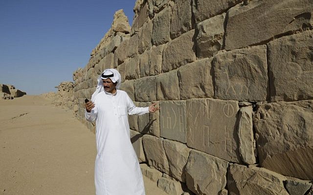 In this photo taken on April. 22, 2015, A Saudi man stands at al-Ukhdood archeological site in Najran, Saudi Arabia.(AP Photo/Hasan Jamali)