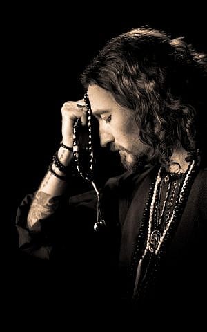 The long-haired and tattooed Kobi Farhi, lead singer of Orphaned Land (Courtesy Orphaned Land)
