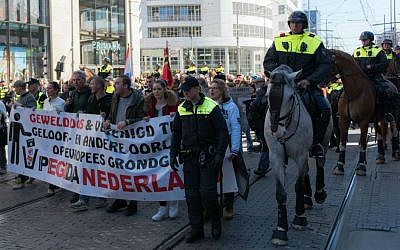 Demonstrators protesting against the arrival of Muslim immigrants to Europe in The Hague, Netherlands, April 10, 2016. (Cnaan Liphshiz/JTA)