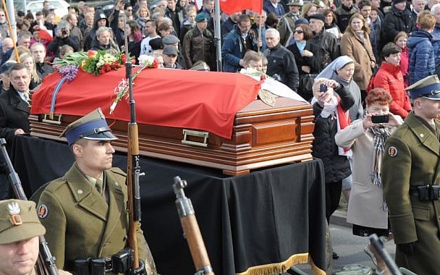 Polish Army soldiers walk next to the coffin with the remains of Zygmunt Szendzielarz during his funeral in Warsaw, Poland, Sunday, April 24, 2016. Polish President Andrzej Duda and government ministers have taken part in the state burial of Szendzielarz, a World War II resistance commander and communist regime victim whose remains were found in a hidden mass grave. (AP/Alik Keplicz) Polish Army soldiers walk next to the coffin with the remains of Zygmunt Szendzielarz during his funeral in Warsaw, Poland, Sunday, April 24, 2016. Polish President Andrzej Duda and government ministers have taken part in the state burial of Szendzielarz, a World War II resistance commander and communist regime victim whose remains were found in a hidden mass grave. (AP/Alik Keplicz)