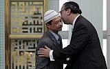 Rabbi Marc Schneier, right, scene with Imam Shamsi Ali, said he is leaving his Westhampton Beach synagogue in part to focus on Muslim-Jewish relations. (Richard Drew/AP)