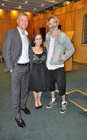 Rabbi Julie Jacobs, flanked by former NFL quarterback Sage Rosenfels, left, and musician Matisyahu, celebrating her rabbinical installation at Beth David Congregation in 2015. (Courtesy of Beth David Congregation/via JTA)