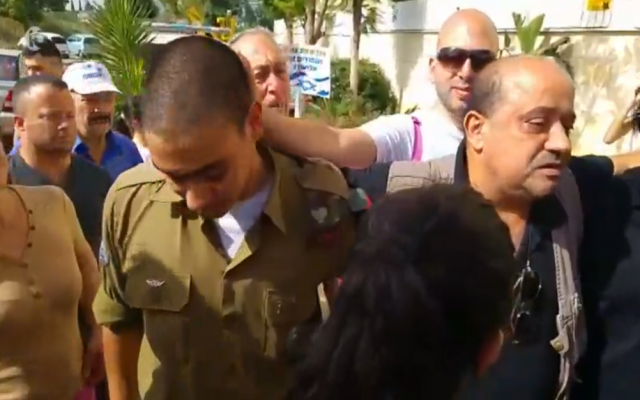Sgt. Elor Azaria, the Israeli soldier who shot dead a disarmed Palestinian terrorist in Hebron last month, arrives home for Passover on furlough from his detention while standing trial on April 22, 2016. (screen capture: Channel 10) Sgt. Elor Azaria, the Israeli soldier who shot dead a disarmed Palestinian terrorist in Hebron last month, arrives home for Passover on furlough from his detention while standing trial on April 22, 2016. (screen capture: Channel 10)