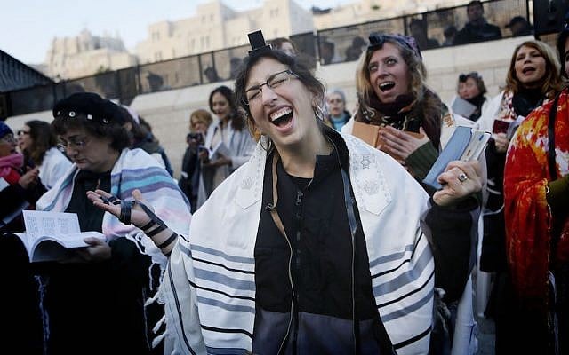 Members of the 'Women of the Wall' organization wear phylacteries as they pray at the Western Wall, Judaism's holiest site, in Jerusalem on January 02, 2014. (Miriam Alster/FLASH90) Members of the 'Women of the Wall' organization wear phylacteries as they pray at the Western Wall, Judaism's holiest site, in Jerusalem on January 02, 2014. (Miriam Alster/FLASH90)
