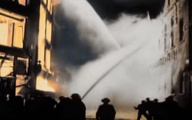 Firefighters battle flames in London during the German Blitz during World War II (YouTube screenshot)