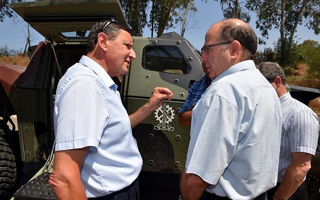 Defense Minister Moshe Ya'alon, left, and newly appointed Defense Ministry Director Udi Adam (Defense Ministry) Defense Minister Moshe Ya'alon, left, and newly appointed Defense Ministry Director Udi Adam (Defense Ministry)