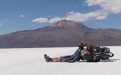 Roei "Jinji" Sadan rests while crossing the desert in Bolivia during his round-the-world bike trip from 2007 to 2011. (Courtesy Roei Sadan)