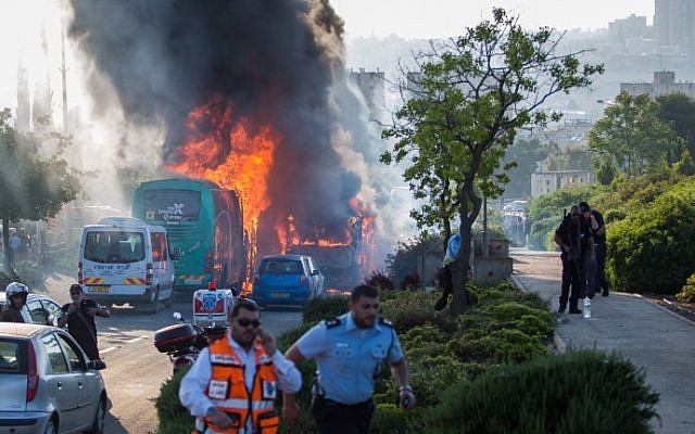 Firefighters and rescue personnel at the scene of a suicide bus bombing in Jerusalem, in which 20 people were wounded, on April 18, 2016, (Nati Shohat/Flash90) Firefighters and rescue personnel at the scene of a suicide bus bombing in Jerusalem, in which 20 people were wounded, on April 18, 2016, (Nati Shohat/Flash90)