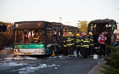 Firefighters and rescue personnel at the scene of a bus bombing in Jerusalem, on April 18, 2016. (Nati Shohat/Flash90)