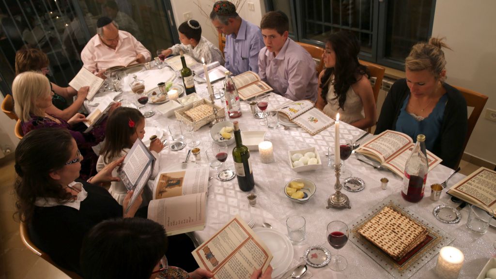 An Israeli family seen during the Passover seder on the first night of the eight-day long Jewish holiday, Tzur Hadassah, April 14, 2014. (Nati Shohat/Flash 90) An Israeli family seen during the Passover seder on the first night of the eight-day long Jewish holiday. (Nati Shohat/Flash 90)