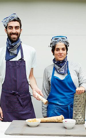 Jeffrey Yoskowitz and Liz Alpern prepare The Gefilteria's carrot-citrus horseradish relish for their book, 'The Gefilte Manifesto.' (Lauren Volo)