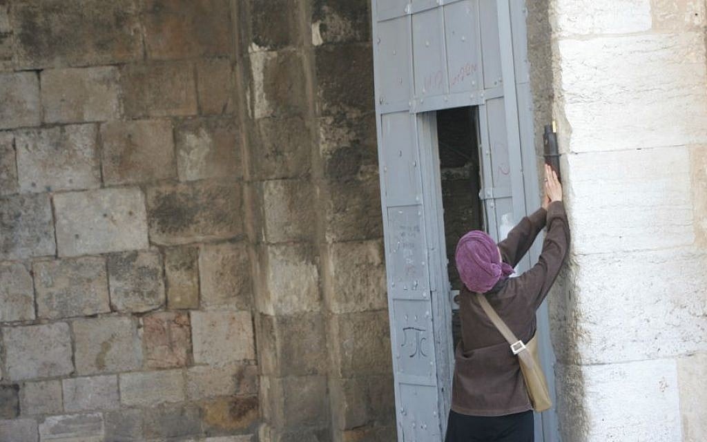 A large mezuzah is fastened to the right hand side of the gate. (Shmuel Bar-Am)