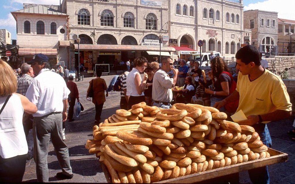 A bread seller caters to tourists inside Jaffa Gate. (Shmuel Bar-Am)