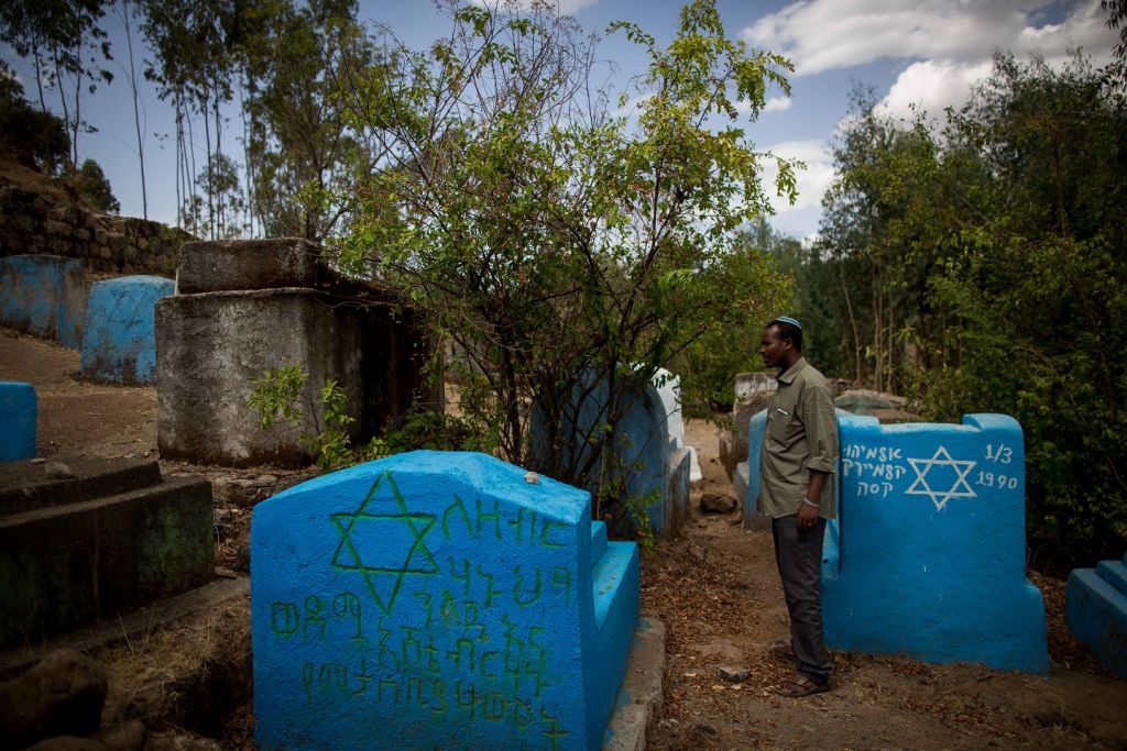 Gashaw Abinet, 29, a cantor at the HaTikvah synagogue in Gondar, visits Wolleka and its Jewish cemetery for the first time on April 24, 2016, although he has lived in Gondar for 17 years awaiting aliyah. (Miriam Alster / Flash9) Gashaw Abinet, 29, a cantor at the HaTikvah synagogue in Gondar, visits Wolleka and its Jewish cemetery for the first time on April 24, 2016, although he has lived in Gondar for 17 years awaiting aliyah. (Miriam Alster / Flash9)