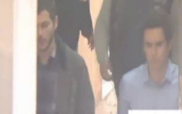 David Geclowitz and Ron Weiner, employees of the Israeli private intelligence firm Black Cube, being brought to the appeals court in Bucharest, after their arrest on suspicion of spying on the country's chief anti-corruption persecutor, April 12, 2016. (Screenshot: Channel 2) David Geclowitz and Ron Weiner, employees of the Israeli private intelligence firm Black Cube, being brought to the appeals court in Bucharest, after their arrest on suspicion of spying on the country's chief anti-corruption persecutor, April 12, 2016. (Screenshot: Channel 2)