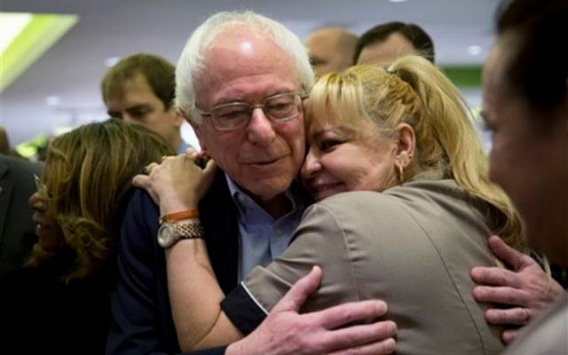 Democratic presidential candidate Sen. Bernie Sanders, I-Vt., right, is hugged by a hotel worker at MGM Grand hotel and casino Saturday, February 20, 2016, in Las Vegas. (AP Photo/Jae C. Hong) Democratic presidential candidate Sen. Bernie Sanders, I-Vt., right, is hugged by a hotel worker at MGM Grand hotel and casino Saturday, February 20, 2016, in Las Vegas. (AP Photo/Jae C. Hong)