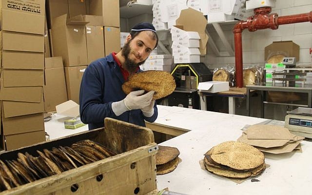 Every shmura matzah is inspected for quality and adherence to kosher standards before it is boxed. (Uriel Heilman) Every shmura matzah is inspected for quality and adherence to kosher standards before it is boxed. (Uriel Heilman/JTA)